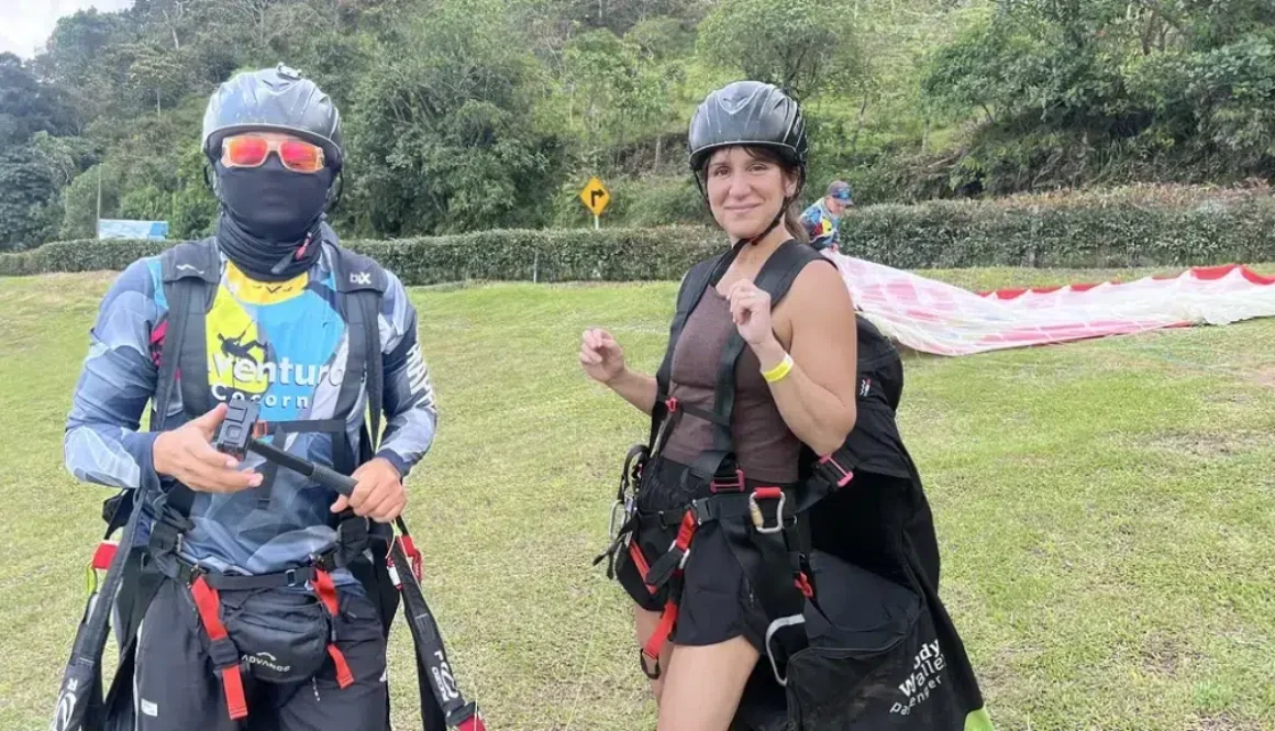 Woman and paragliding pilot geared up and ready to launch in Medellín — unique things to do in Medellín