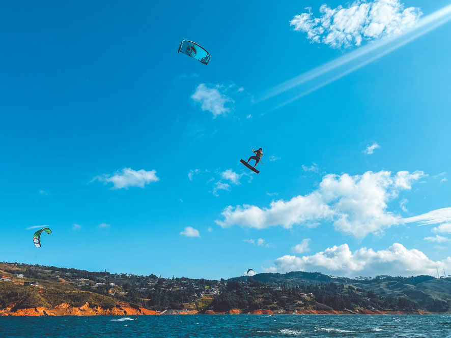 kitesurfer jumping in lake Calima kitesurfing Colombia