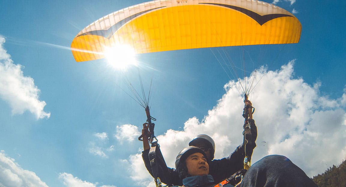 Paraglider flying kite camp lake calima