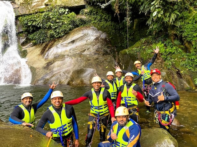 Tourists canyoning Medellin