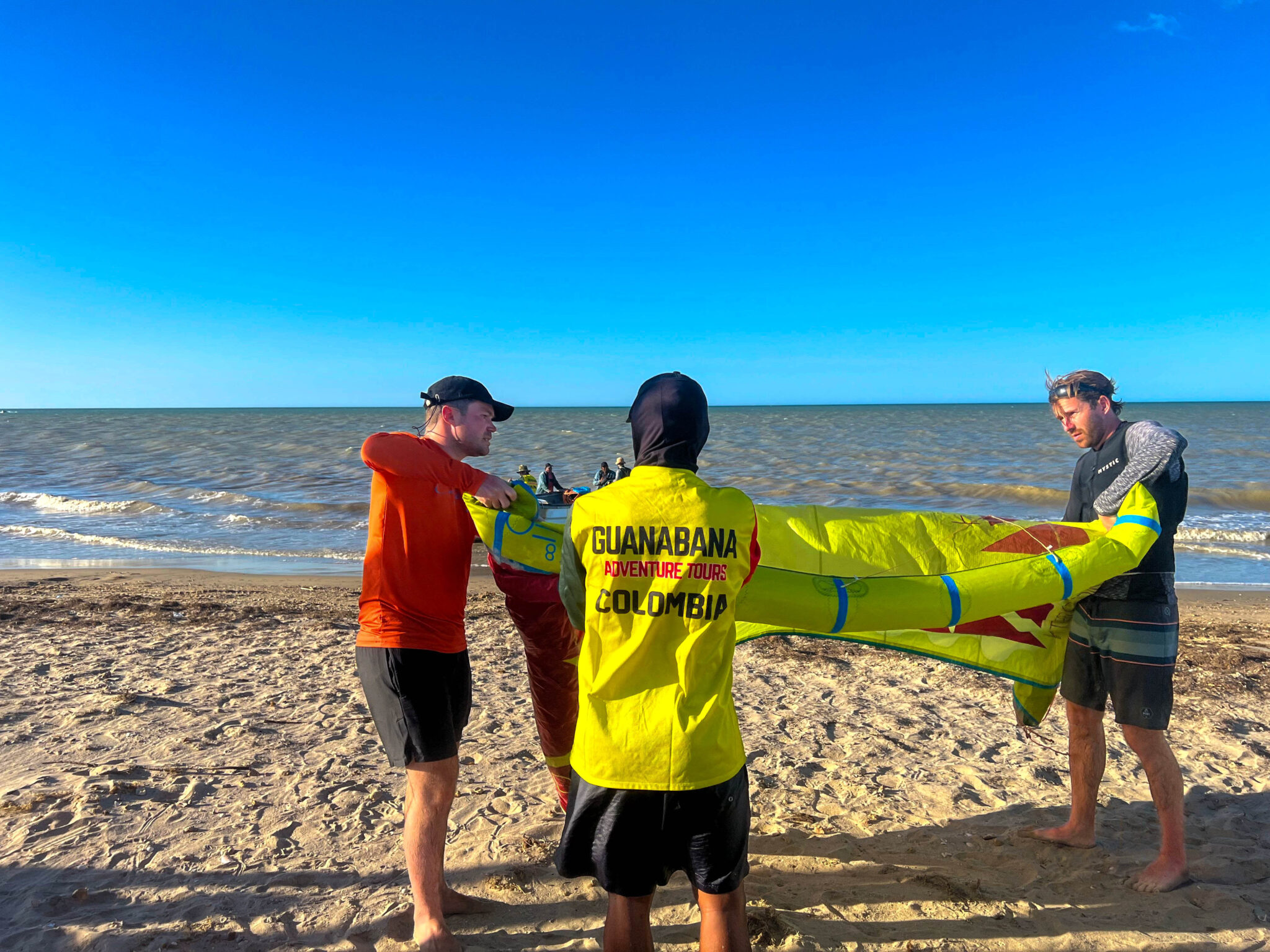 folding up a kitesurfing kite on kite trips Colombia