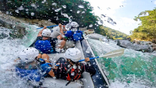 Raft in Class IV rapids while white water rafting in Medellin