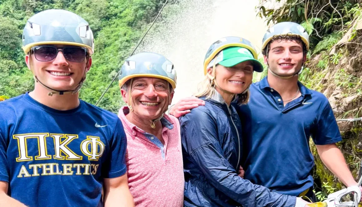 family rock climbing during a day trips medellin