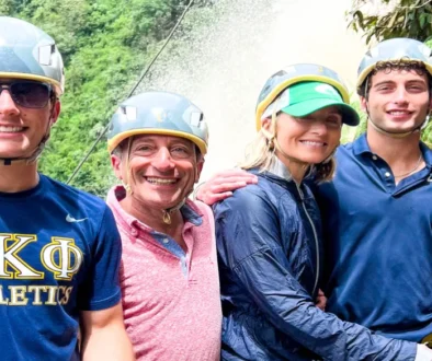 family rock climbing during a day trips medellin