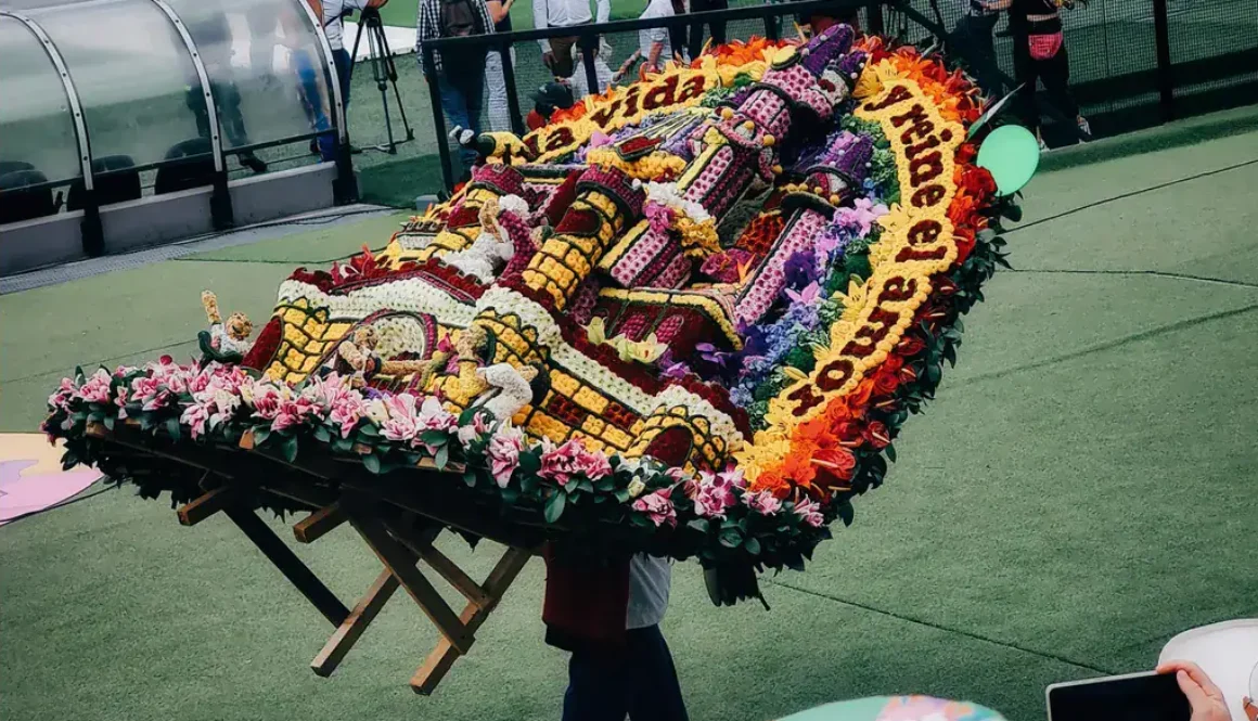 Medellin Flower Festival silletero carrying flowers on his back