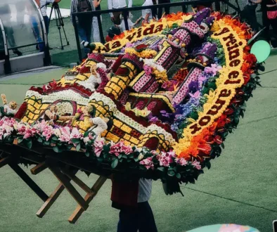 Medellin Flower Festival silletero carrying flowers on his back